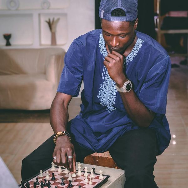 Calendar and a sports watch on a wooden table, symbolizing lifestyle integration.
